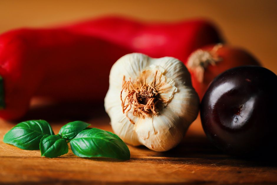 Fresh sour plums, garlic and chili peppers for tkemali sauce
